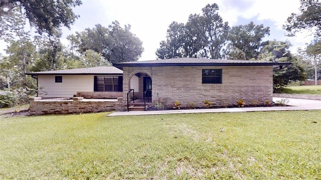 4121 SW 6th Ave, Ocala, FL 34471 - single story home with a front yard and stone siding