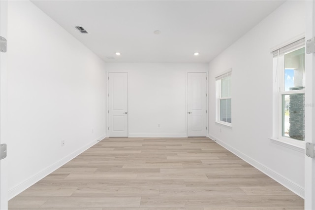 10032 SW 85th Place Rd, Ocala, FL 34481 - empty room with light wood-style floors, healthy amount of natural light, and recessed lighting