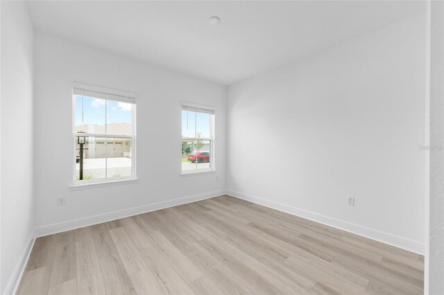 10032 SW 85th Place Rd, Ocala, FL 34481 - spare room with light wood finished floors and baseboards