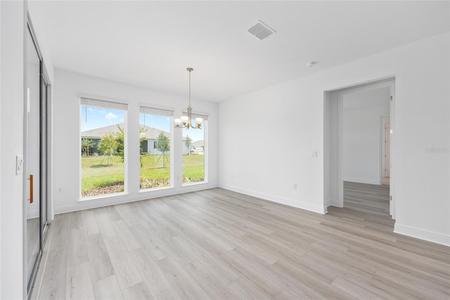 10032 SW 85th Place Rd, Ocala, FL 34481 - unfurnished dining area with a chandelier and light wood-type flooring