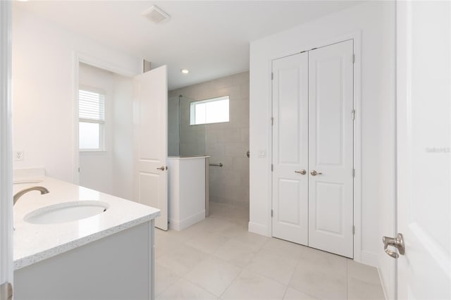 10032 SW 85th Place Rd, Ocala, FL 34481 - full bath featuring vanity, walk in shower, tile patterned flooring, and recessed lighting