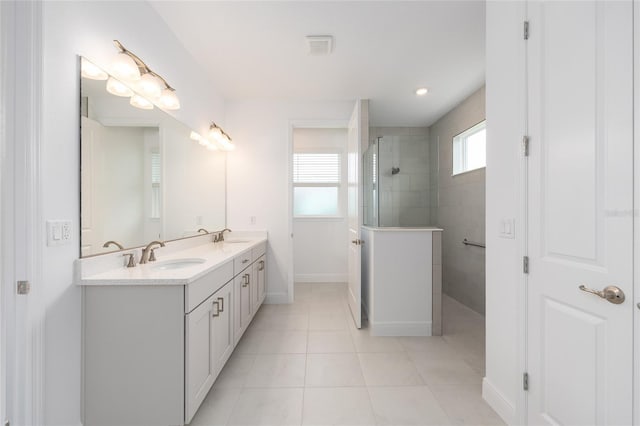 10032 SW 85th Place Rd, Ocala, FL 34481 - bathroom featuring double vanity, a walk in shower, and tile patterned flooring