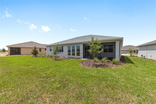 10032 SW 85th Place Rd, Ocala, FL 34481 - back of property with a yard and stucco siding