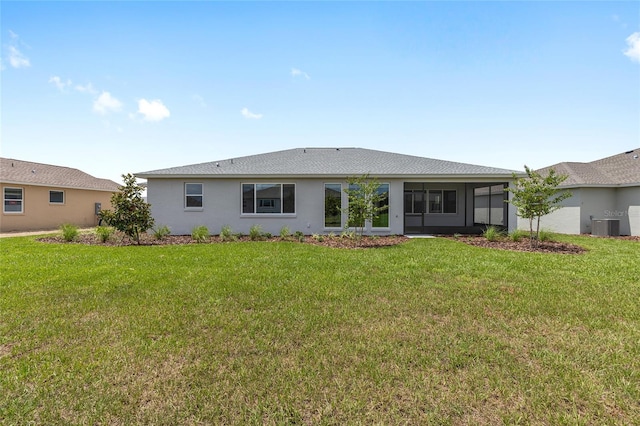 10032 SW 85th Place Rd, Ocala, FL 34481 - back of house featuring a yard, stucco siding, and a sunroom