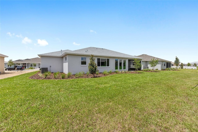 10032 SW 85th Place Rd, Ocala, FL 34481 - rear view of house featuring a yard and stucco siding