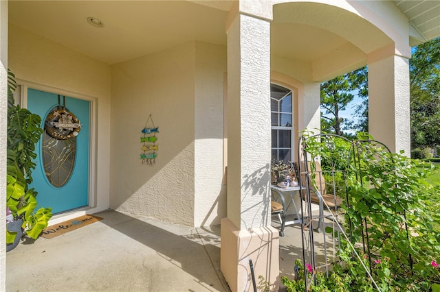 1824 W Zoe Ct, Lecanto, FL 34461 - view of exterior entry with stucco siding