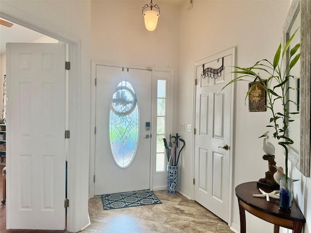 1824 W Zoe Ct, Lecanto, FL 34461 - foyer featuring a towering ceiling and baseboards