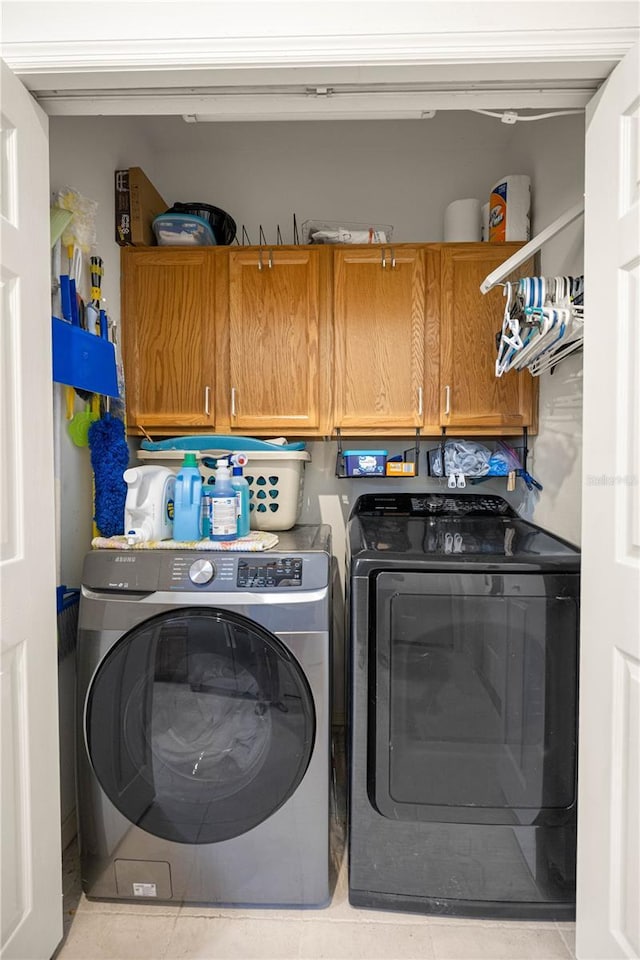 1824 W Zoe Ct, Lecanto, FL 34461 - laundry room with cabinet space, separate washer and dryer, and tile patterned floors