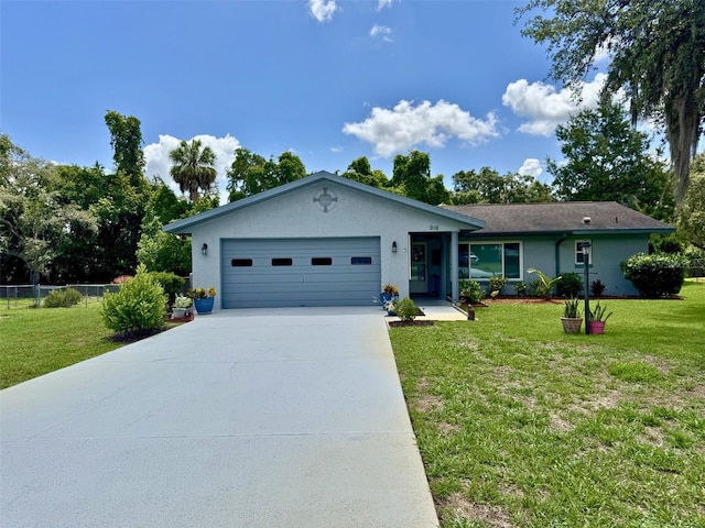 916 Jones Ave, Inverness, FL 34453 - ranch-style home featuring an attached garage, driveway, and stucco siding