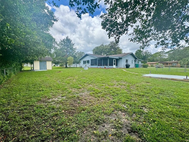 916 Jones Ave, Inverness, FL 34453 - fenced backyard featuring a sunroom and a shed