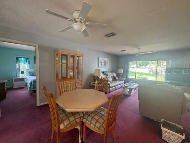 916 Jones Ave, Inverness, FL 34453 - carpeted dining space featuring a ceiling fan