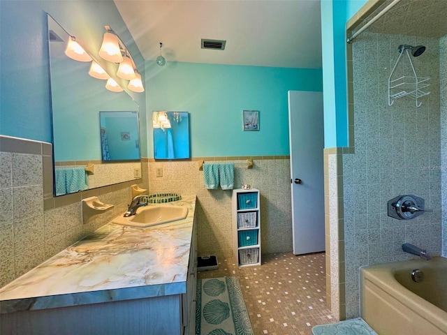 916 Jones Ave, Inverness, FL 34453 - full bath featuring tile walls, vanity,  shower combination, and wainscoting