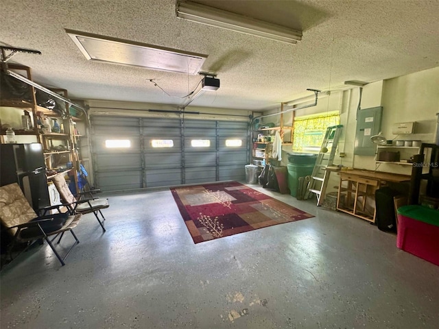 916 Jones Ave, Inverness, FL 34453 - garage featuring electric panel, a garage door opener, and freestanding refrigerator