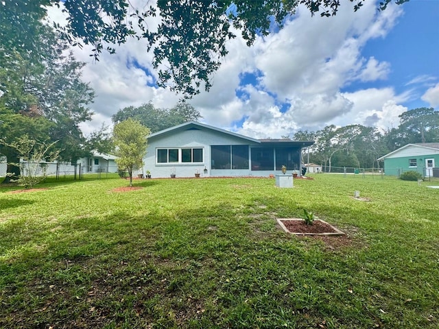 916 Jones Ave, Inverness, FL 34453 - rear view of house featuring a sunroom