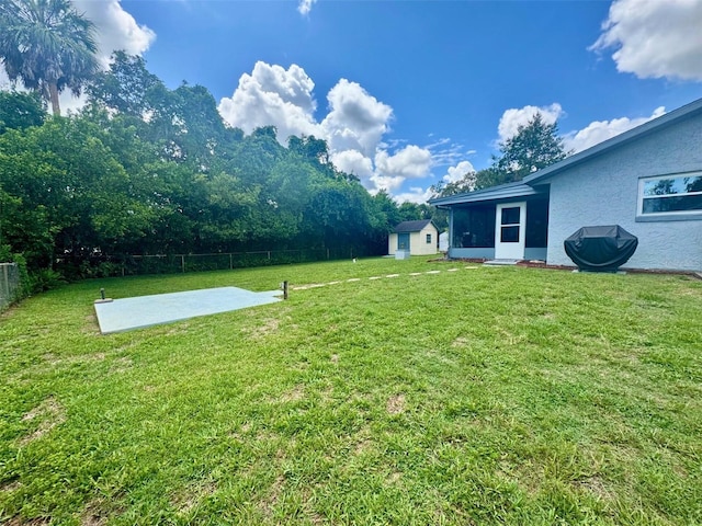 916 Jones Ave, Inverness, FL 34453 - view of yard with a patio area, a sunroom, and an outdoor structure