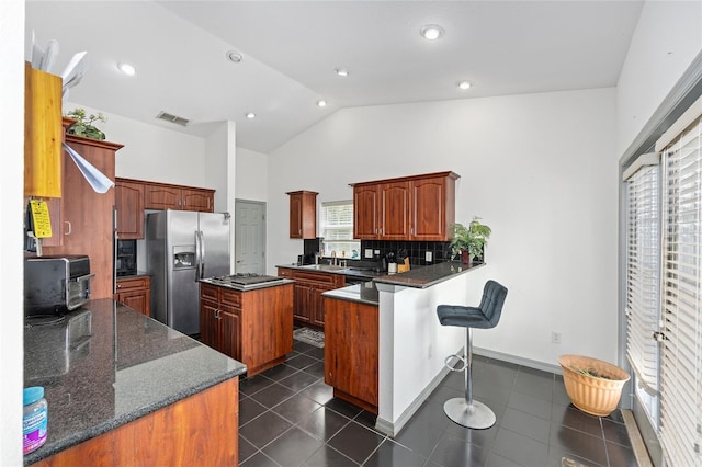 12320 SW 62nd Pl, Ocala, FL 34481 - kitchen with stainless steel appliances, a peninsula, decorative backsplash, plenty of natural light, and recessed lighting