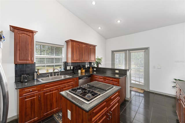 12320 SW 62nd Pl, Ocala, FL 34481 - kitchen with stovetop with downdraft, stainless steel dishwasher, backsplash, dark countertops, and recessed lighting