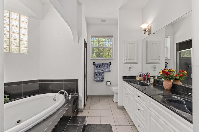 12320 SW 62nd Pl, Ocala, FL 34481 - full bath featuring a garden tub, double vanity, a shower with shower door, and tile patterned flooring