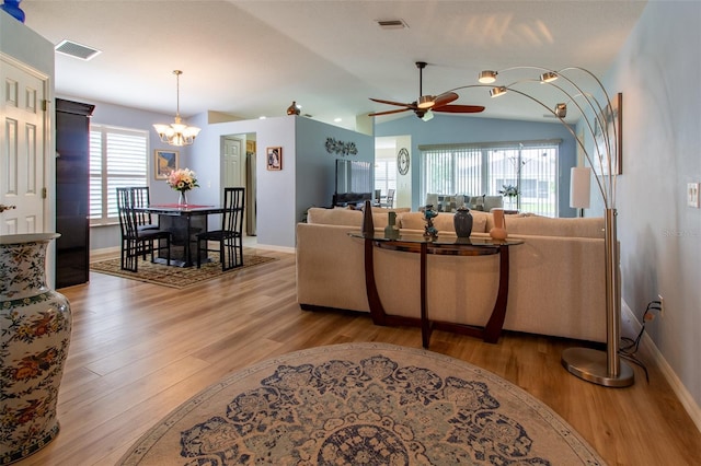1768 SW 156th Ln, Ocala, FL 34473 - living area featuring wood finished floors, a chandelier, ceiling fan, and lofted ceiling