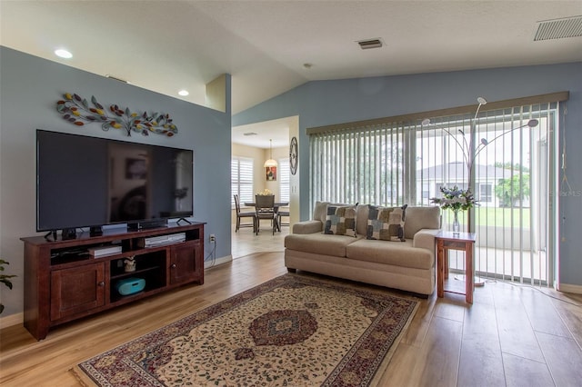 1768 SW 156th Ln, Ocala, FL 34473 - living room with light wood finished floors and lofted ceiling