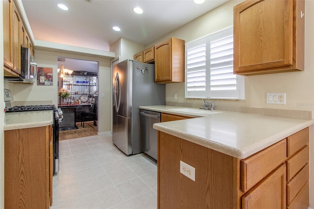 1768 SW 156th Ln, Ocala, FL 34473 - kitchen with appliances with stainless steel finishes, light countertops, recessed lighting, light tile patterned flooring, and a peninsula