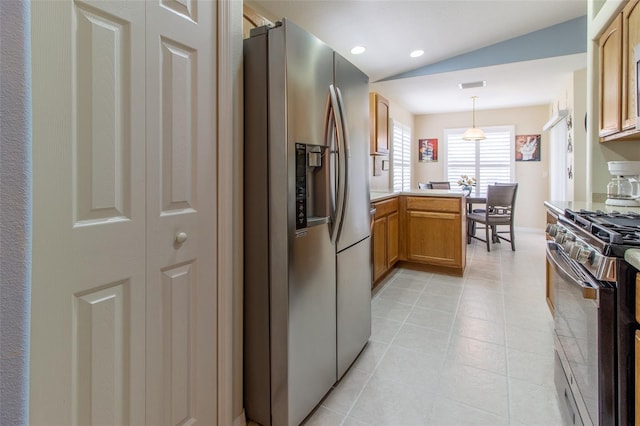 1768 SW 156th Ln, Ocala, FL 34473 - kitchen with appliances with stainless steel finishes, a peninsula, pendant lighting, light countertops, and vaulted ceiling