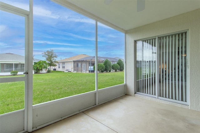 1768 SW 156th Ln, Ocala, FL 34473 - unfurnished sunroom with a ceiling fan and a residential view