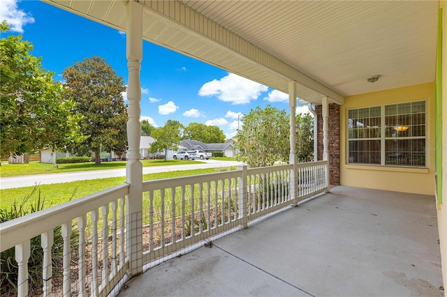 6551 SE 11th Loop, Ocala, FL 34472 - porch with a residential view and a lawn