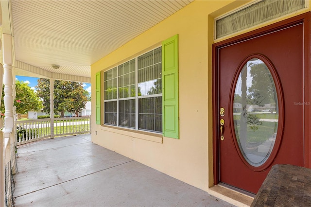 6551 SE 11th Loop, Ocala, FL 34472 - entrance to property with a porch and stucco siding