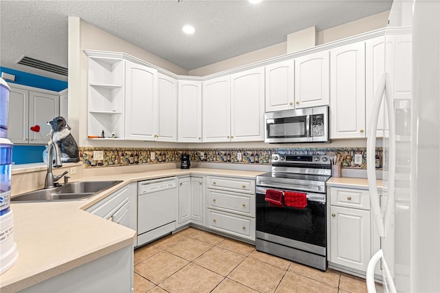 6551 SE 11th Loop, Ocala, FL 34472 - kitchen featuring appliances with stainless steel finishes, open shelves, a textured ceiling, white cabinets, and recessed lighting
