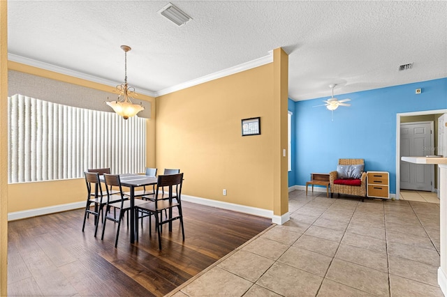 6551 SE 11th Loop, Ocala, FL 34472 - dining room with a textured ceiling, crown molding, a ceiling fan, and wood finished floors