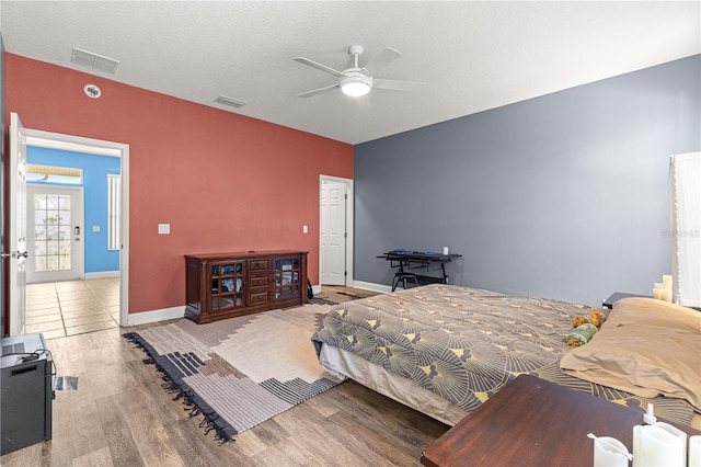 6551 SE 11th Loop, Ocala, FL 34472 - bedroom with wood finished floors and a ceiling fan
