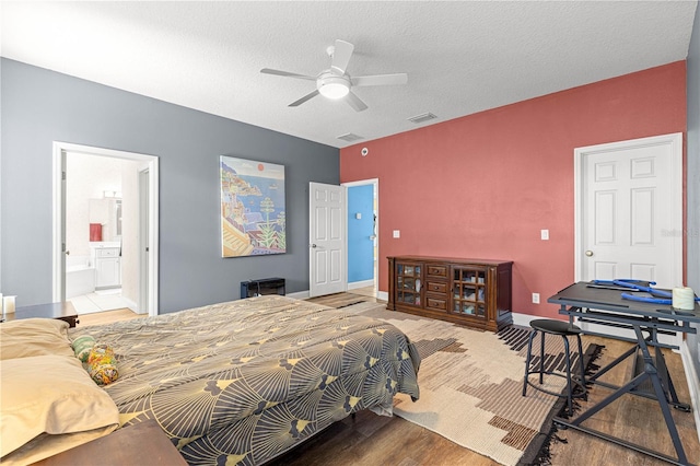 6551 SE 11th Loop, Ocala, FL 34472 - bedroom featuring wood finished floors, a ceiling fan, and connected bathroom