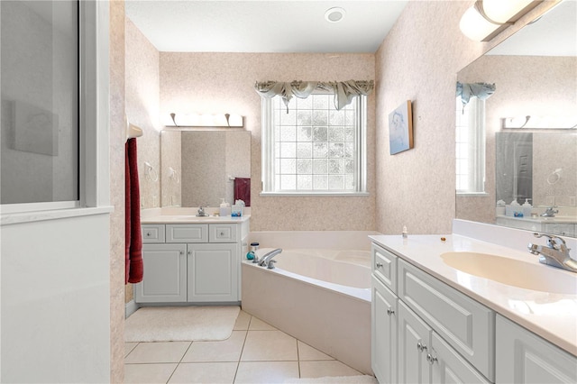 6551 SE 11th Loop, Ocala, FL 34472 - full bath with healthy amount of natural light, a bath, two vanities, tile patterned flooring, and wallpapered walls