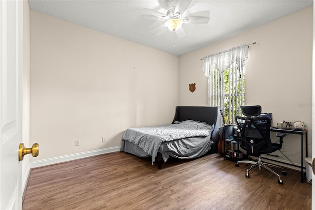 6551 SE 11th Loop, Ocala, FL 34472 - bedroom with wood finished floors, an office area, and a ceiling fan