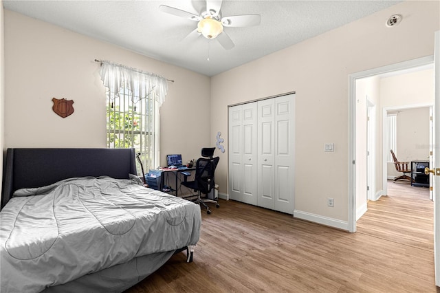 6551 SE 11th Loop, Ocala, FL 34472 - bedroom with light wood finished floors, a closet, ceiling fan, and a desk