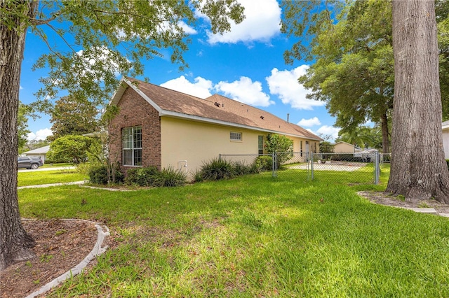 6551 SE 11th Loop, Ocala, FL 34472 - view of property exterior with stucco siding and brick siding