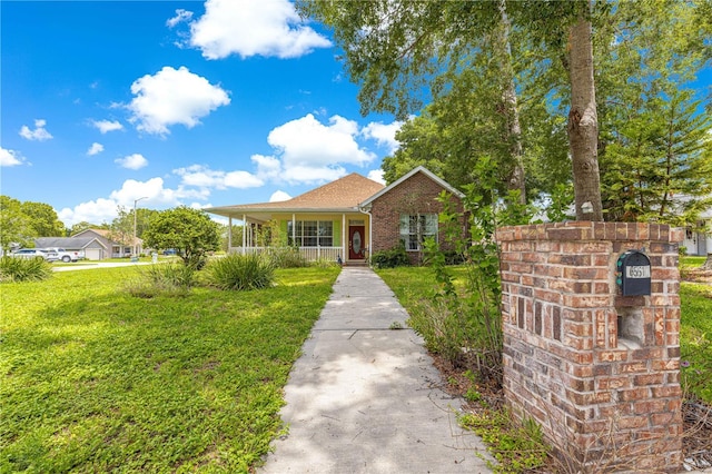 6551 SE 11th Loop, Ocala, FL 34472 - view of front of property featuring a porch and a front lawn