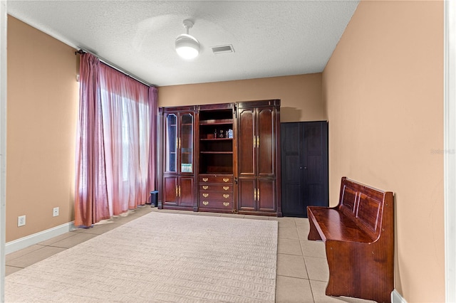 6551 SE 11th Loop, Ocala, FL 34472 - sitting room featuring light tile patterned floors and a textured ceiling