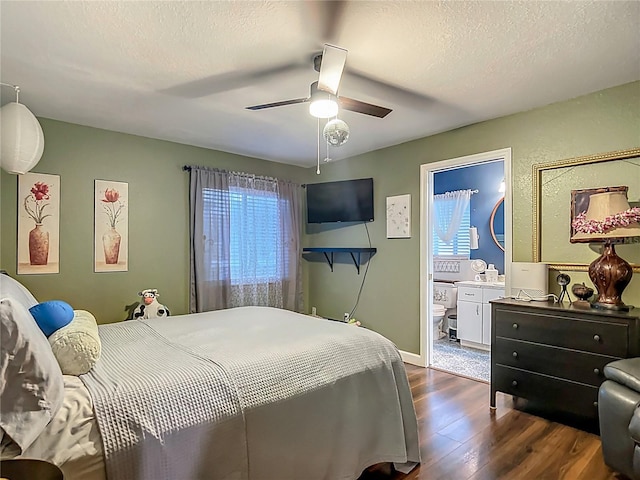 10459 SW 62nd Ct, Ocala, FL 34476 - bedroom featuring dark wood-style flooring, multiple windows, a textured ceiling, a ceiling fan, and ensuite bathroom