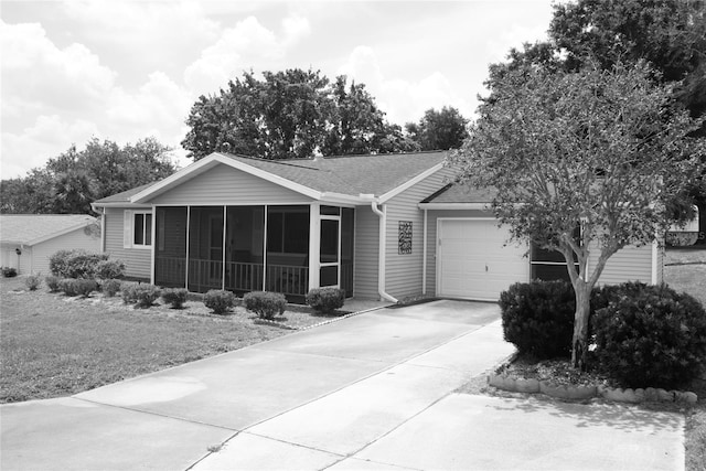8650 SW 108th Pl, Ocala, FL 34481 - ranch-style home with a sunroom, a garage, driveway, and a shingled roof