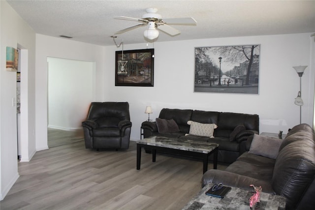 8650 SW 108th Pl, Ocala, FL 34481 - living room with wood finished floors and ceiling fan