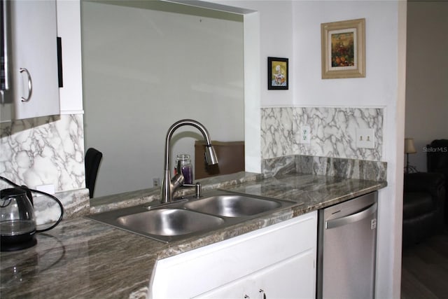 8650 SW 108th Pl, Ocala, FL 34481 - kitchen with dishwasher, backsplash, and white cabinets