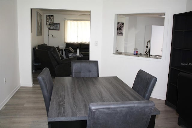 8650 SW 108th Pl, Ocala, FL 34481 - dining area featuring wood finished floors and baseboards