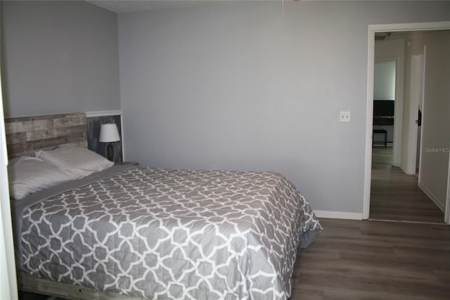 8650 SW 108th Pl, Ocala, FL 34481 - bedroom featuring wood finished floors and baseboards
