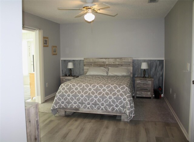 8650 SW 108th Pl, Ocala, FL 34481 - bedroom with wood finished floors and a ceiling fan