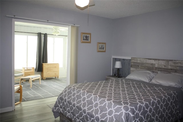 8650 SW 108th Pl, Ocala, FL 34481 - bedroom with wood finished floors and ceiling fan