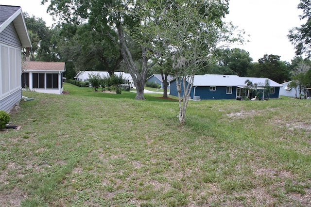 8650 SW 108th Pl, Ocala, FL 34481 - view of grassy yard with a sunroom