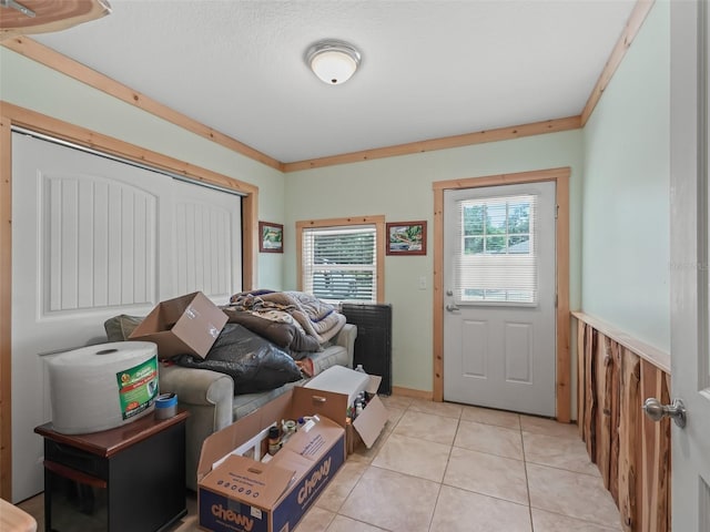 4660 SE 142nd Ln, Summerfield, FL 34491 - entrance foyer featuring light tile patterned floors and a wainscoted wall