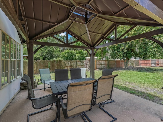 4660 SE 142nd Ln, Summerfield, FL 34491 - fenced backyard with outdoor dining area, a patio area, and a gazebo